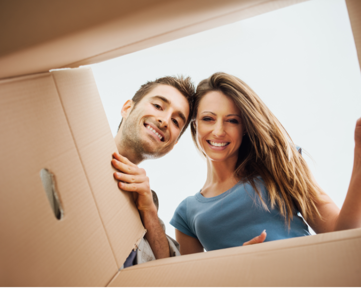 two people looking into box